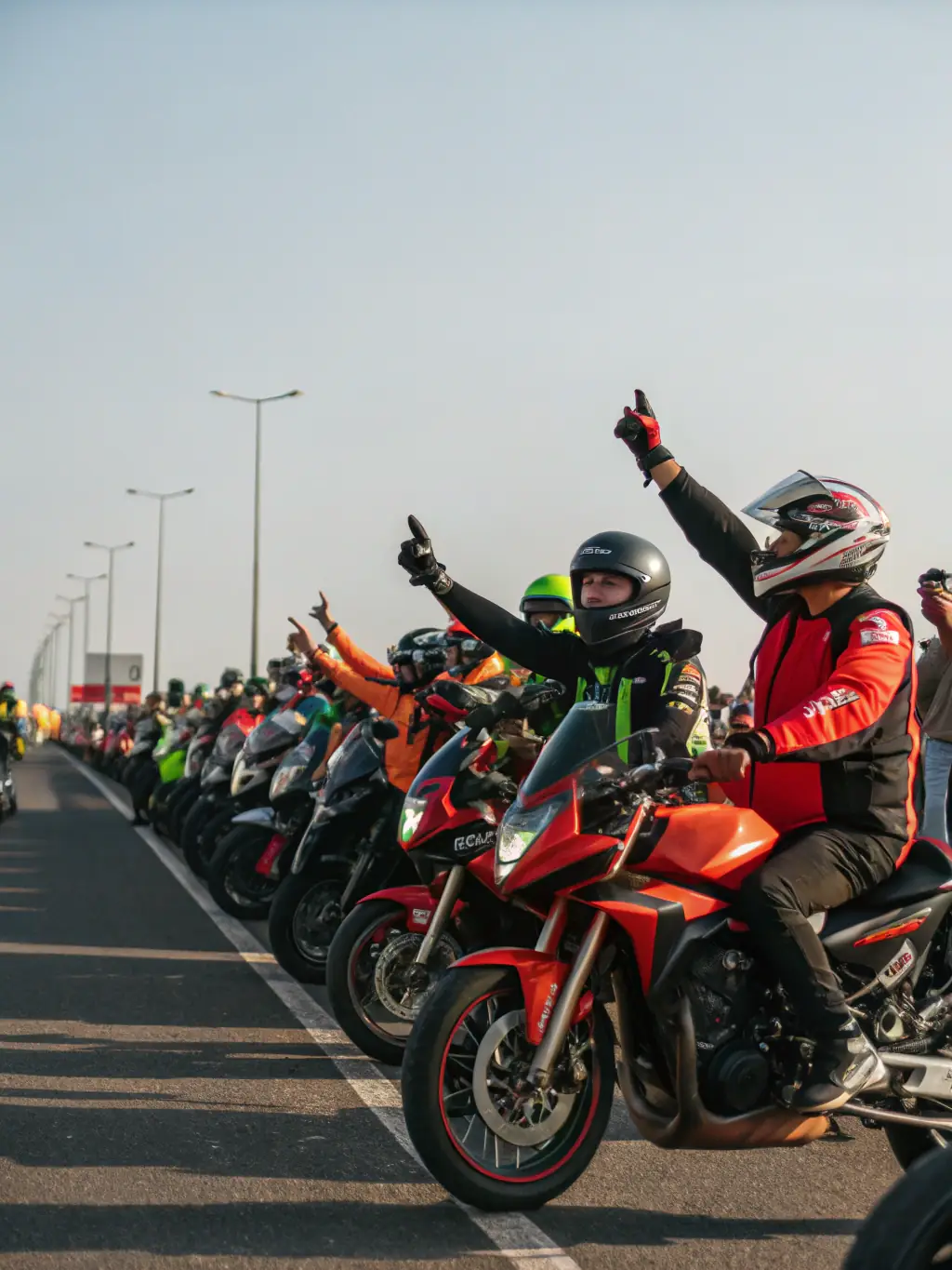 A group of motorcyclists preparing for a track day event, showcasing the excitement and camaraderie of the TEAM GRIP ATTACK community.